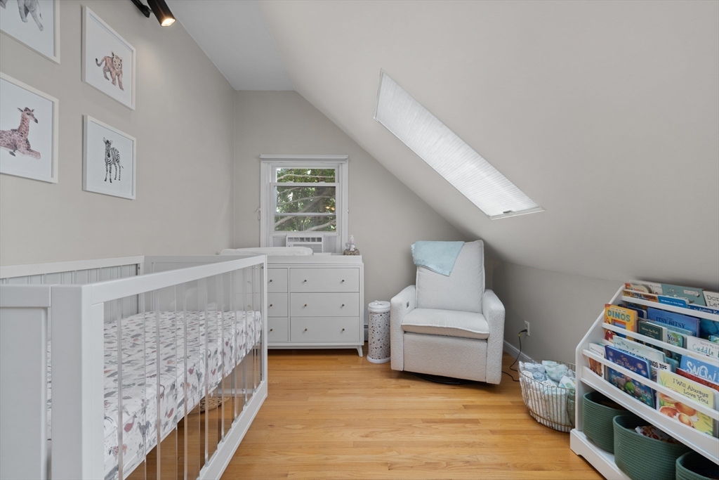 27 Pleasant Street Millis, MA 02054 - Photo 33 of 42 a living room with furniture and baby crib