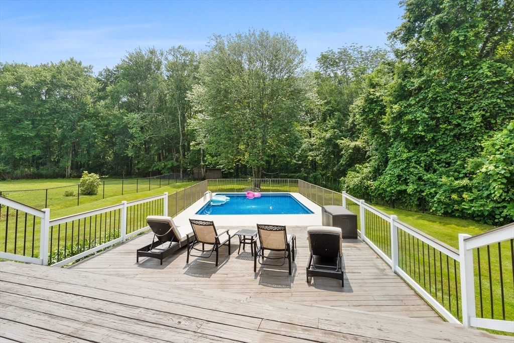 27 Pleasant Street Millis, MA 02054 - Photo 38 of 42 a view of a chairs and table on the wooden floor
