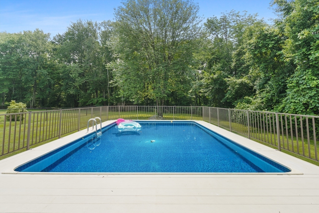 27 Pleasant Street Millis, MA 02054 - Photo 39 of 42 a view of a swimming pool with a lake view