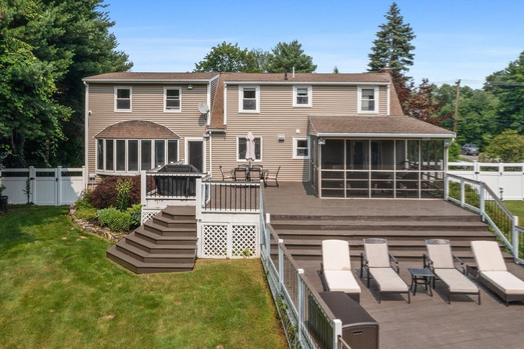 27 Pleasant Street Millis, MA 02054 - Photo 40 of 42 a front view of a house with a yard