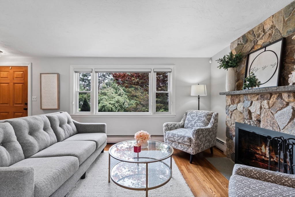 27 Pleasant Street Millis, MA 02054 - Photo 6 of 42 a living room with furniture and a fireplace