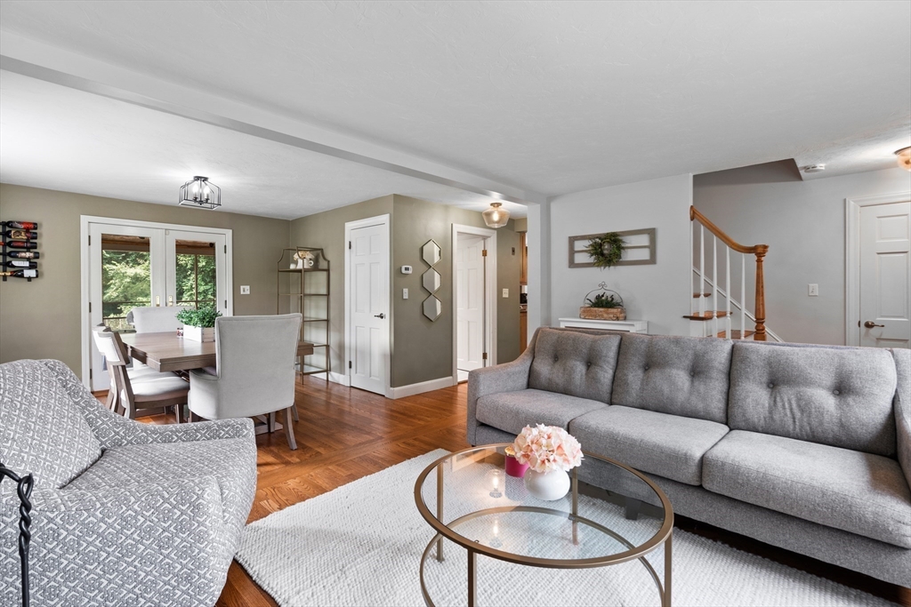 27 Pleasant Street Millis, MA 02054 - Photo 7 of 42 a living room with furniture potted plant and a table