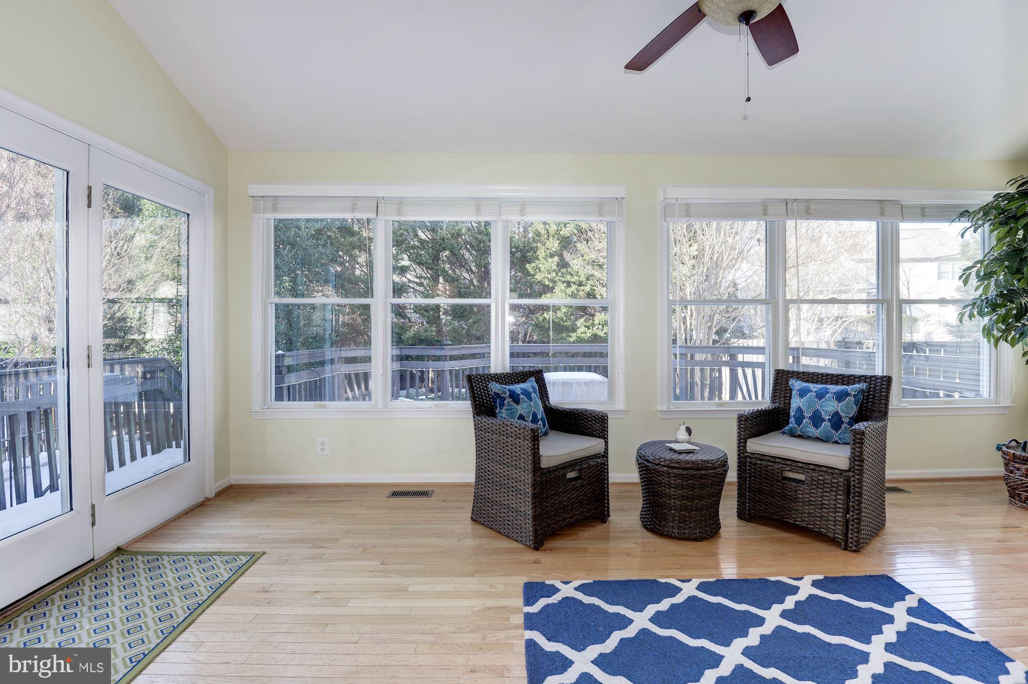 1326 Murray Downs Way Reston, VA 20194 - Photo 9 of 41 a living room with furniture and a floor to ceiling window