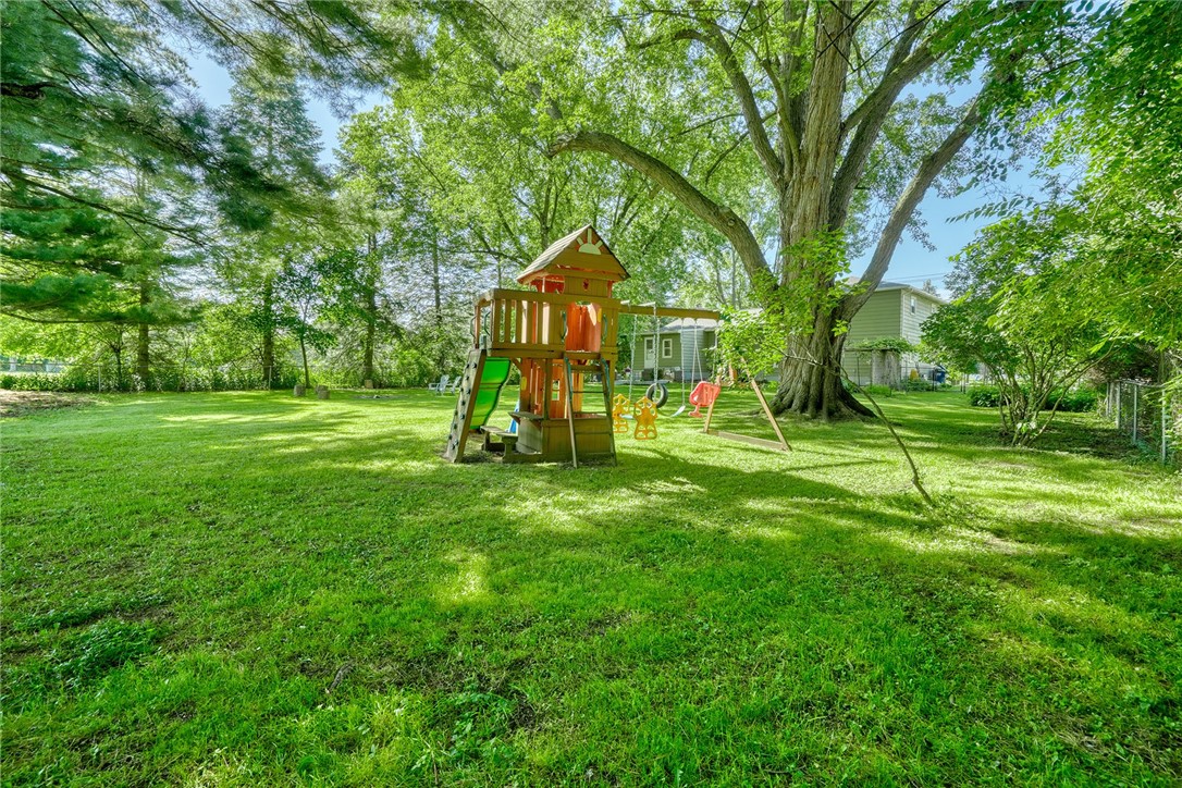 1038 Whalen Road Penfield, NY 14526 - Photo 38 of 46 Backyard view with swingset