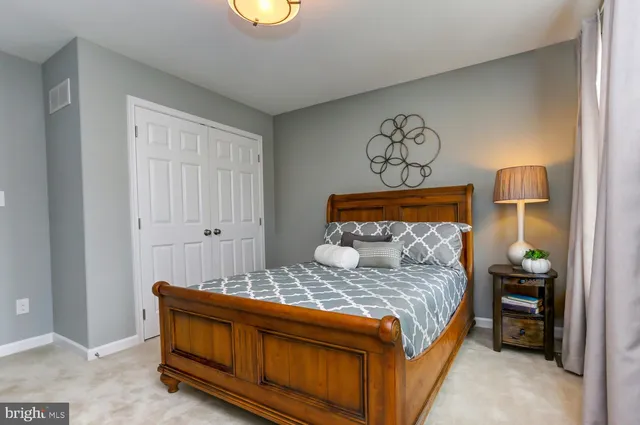 a bedroom with a bed and a table