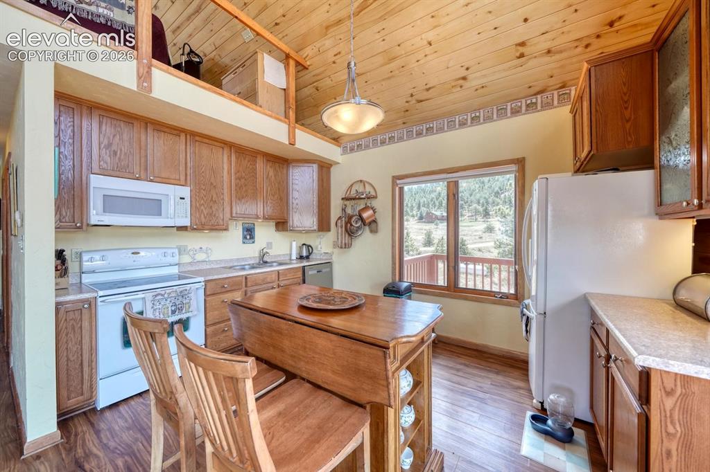 489 Excelsior Road Westcliffe, CO 81252 - Photo 4 of 34 a view of a dining room with furniture window and wooden floor
