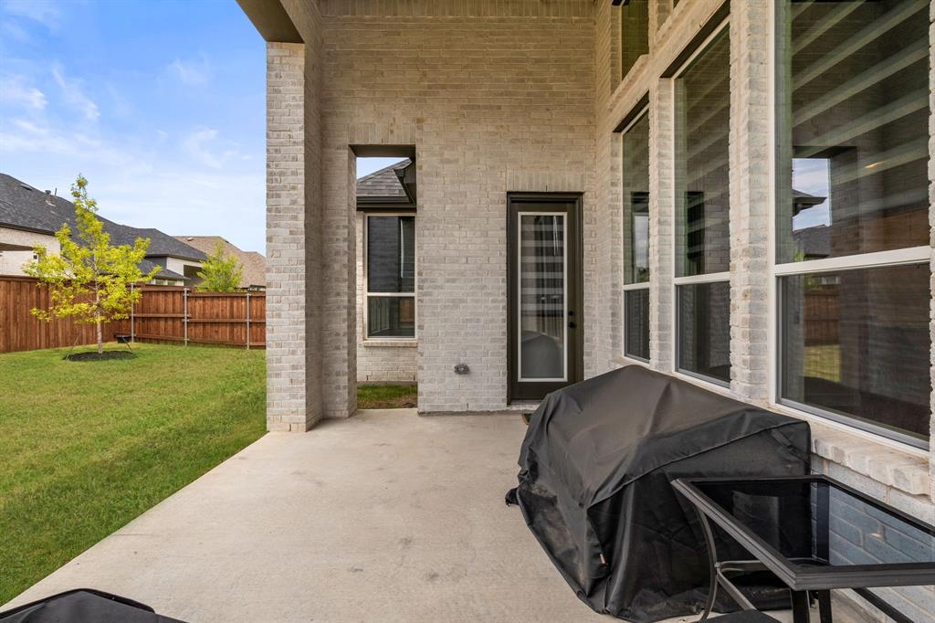 4805 Impression Lane Prosper, TX 75078 - Photo 23 of 34 a view of backyard with cabin
