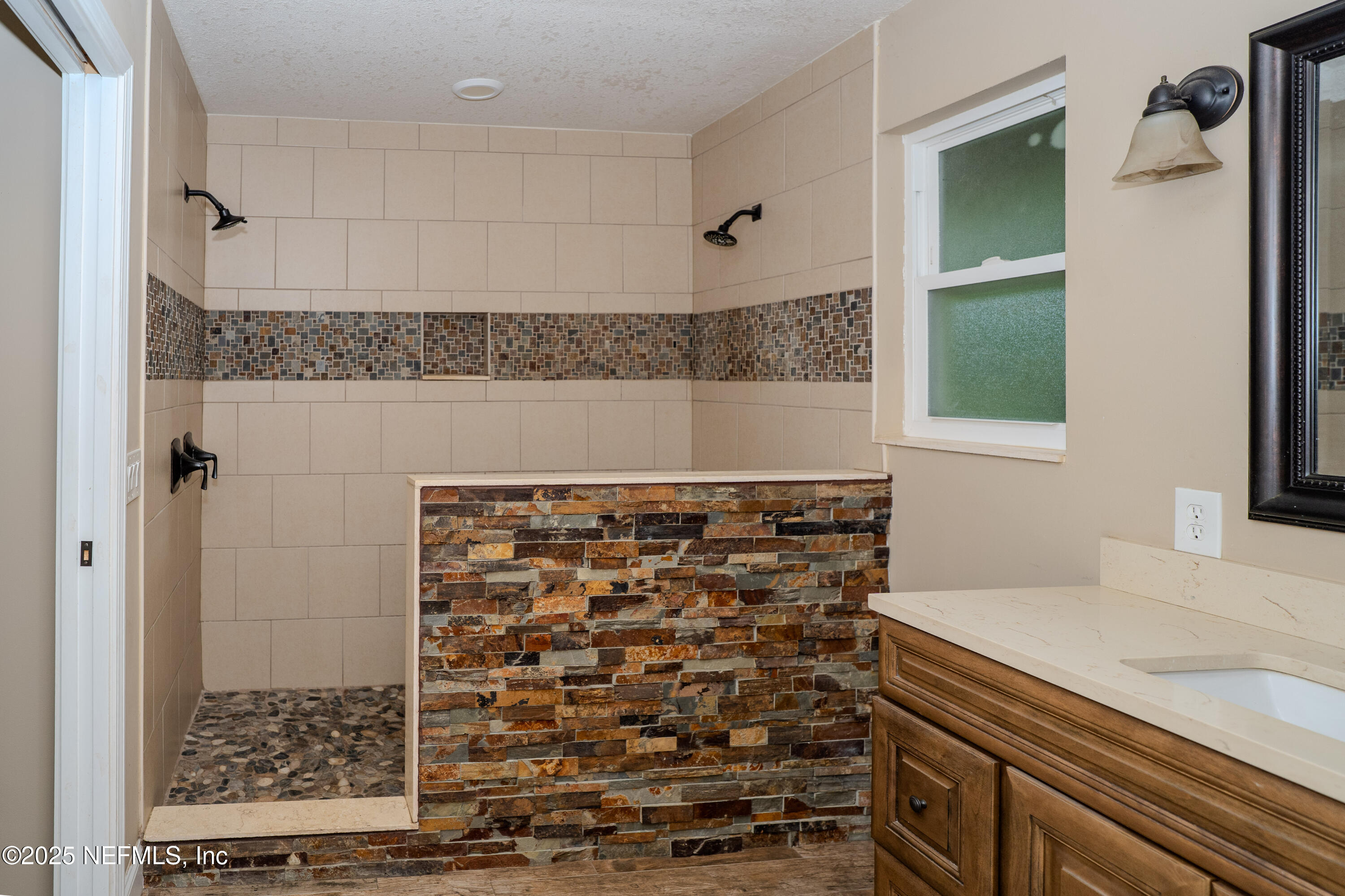 3098 Pacetti Road, Unit I St. Augustine, FL 32092 - Photo 13 of 29 a bathroom with a shower and a sink