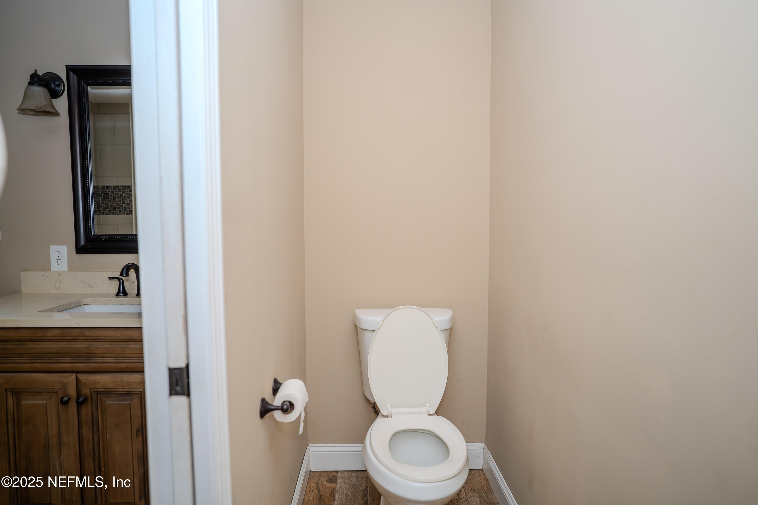 3098 Pacetti Road, Unit I St. Augustine, FL 32092 - Photo 14 of 29 a white toilet sitting next to a bathroom sink