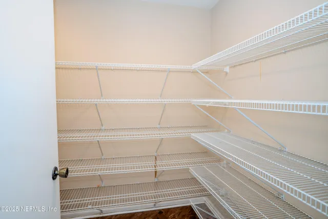 a view of an empty walk in closet