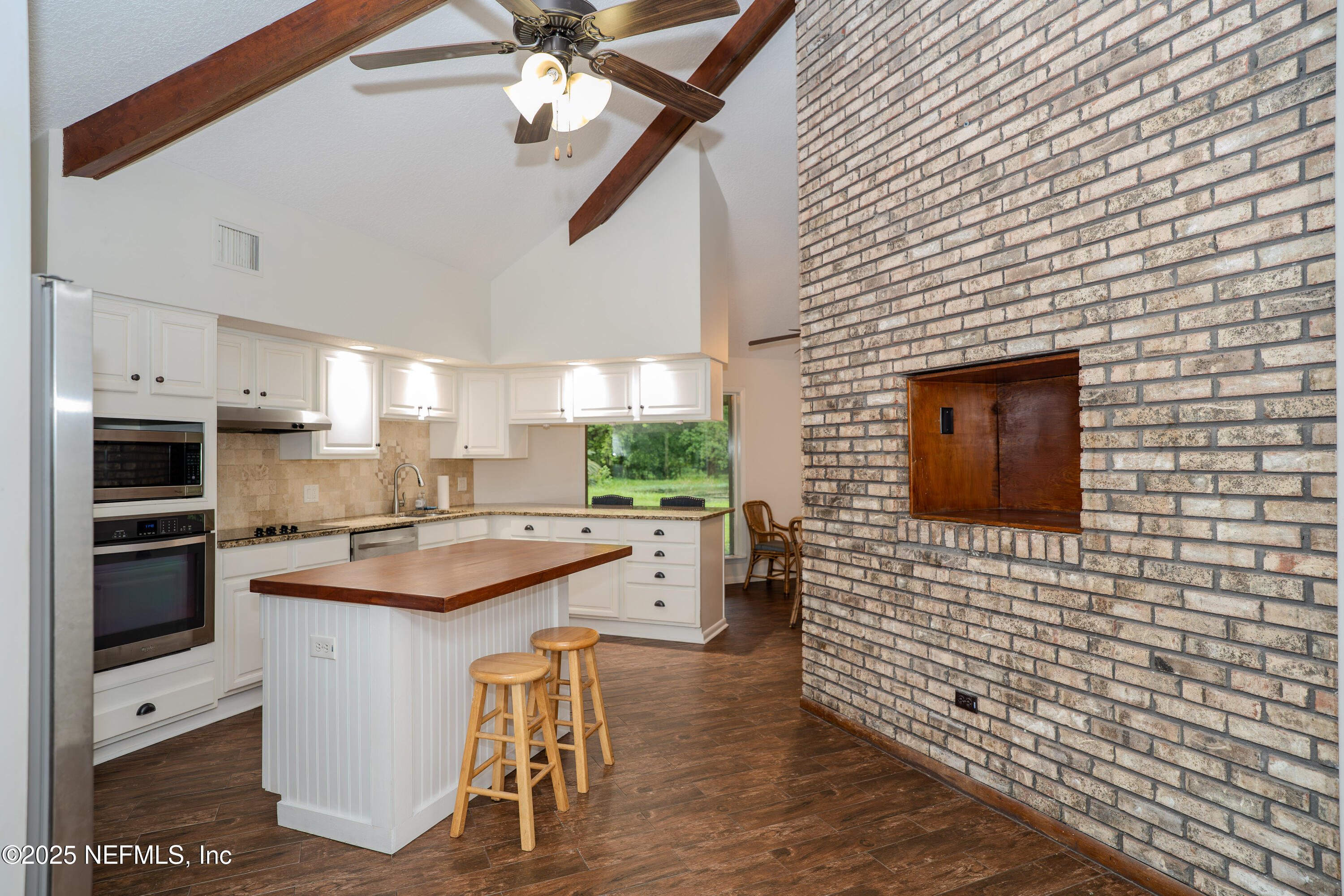 3098 Pacetti Road, Unit I St. Augustine, FL 32092 - Photo 18 of 29 a kitchen with a sink cabinets and stainless steel appliances