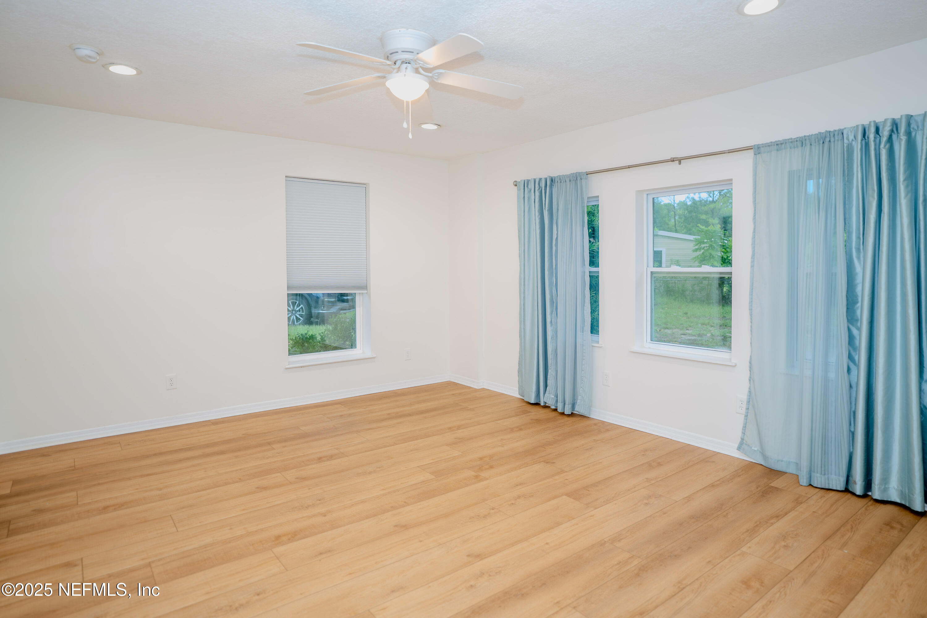 3098 Pacetti Road, Unit I St. Augustine, FL 32092 - Photo 19 of 29 a bedroom with a bed and a window