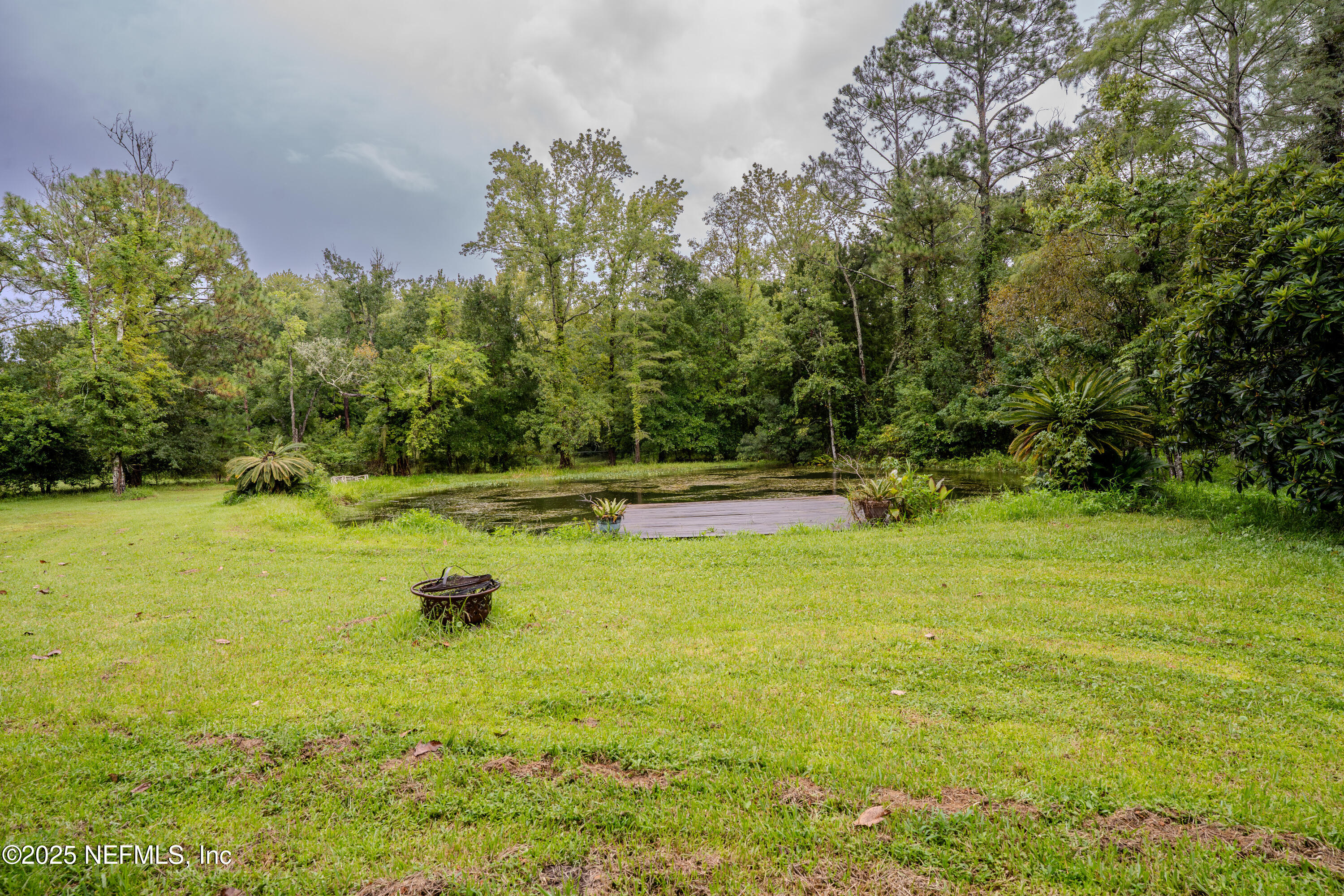 3098 Pacetti Road, Unit I St. Augustine, FL 32092 - Photo 25 of 29 a view of a swimming pool with an outdoor space and seating area