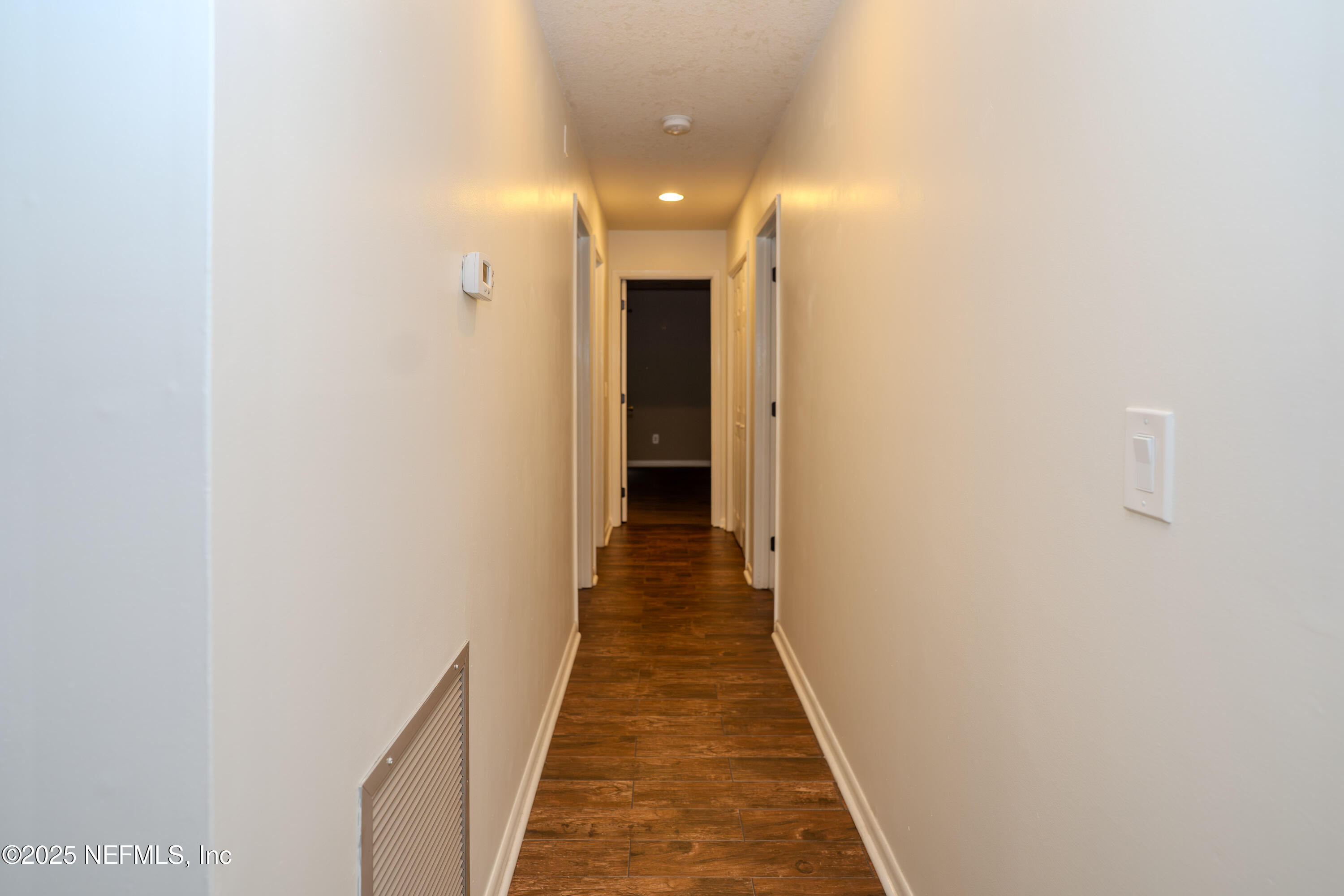 3098 Pacetti Road, Unit I St. Augustine, FL 32092 - Photo 6 of 29 a view of a hallway with wooden floor