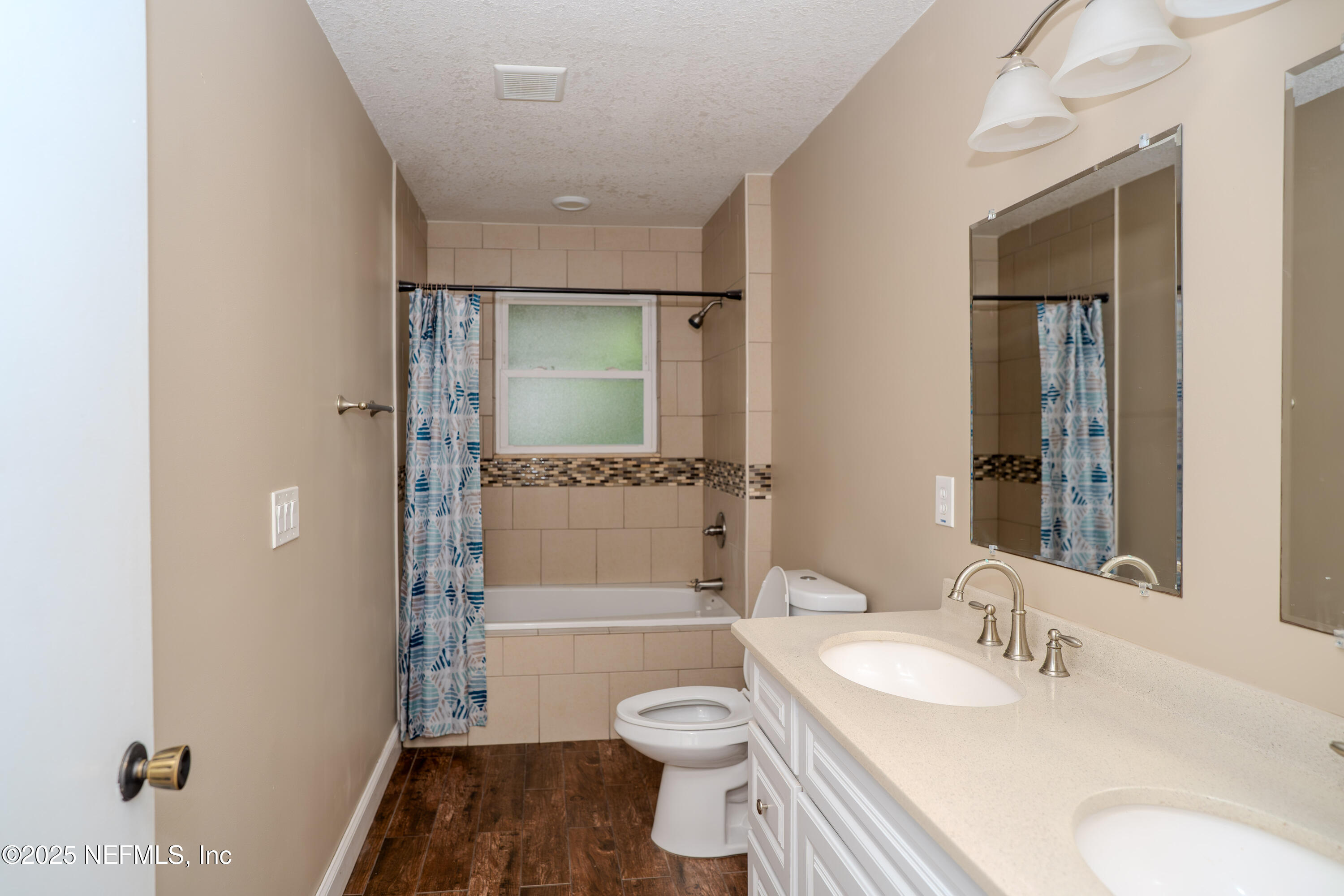 3098 Pacetti Road, Unit I St. Augustine, FL 32092 - Photo 9 of 29 a bathroom with a sink a toilet and shower