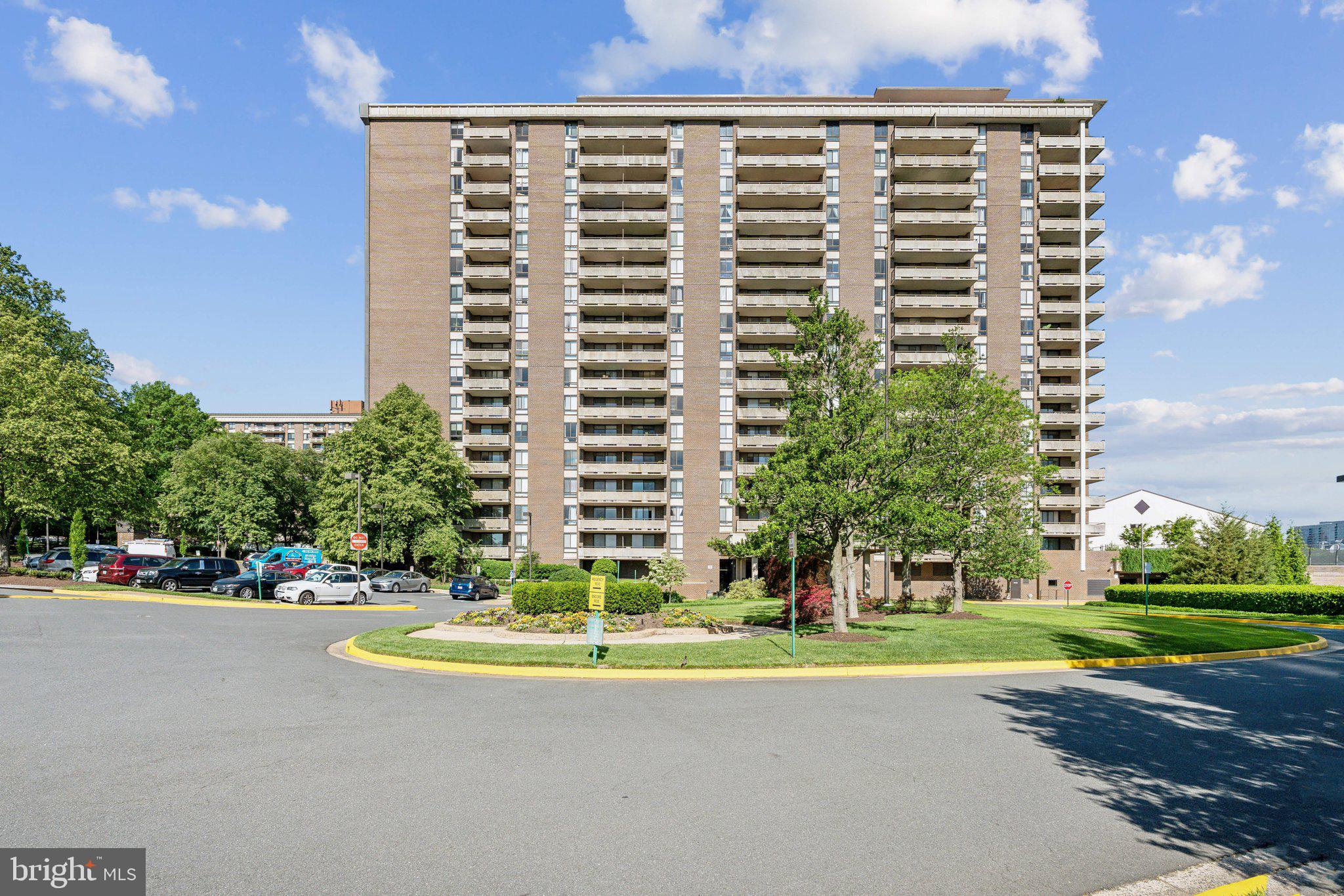 1800 Old Meadow Road, Unit 115 McLean, VA 22102 - Photo 2 of 35 a view of a building with a yard