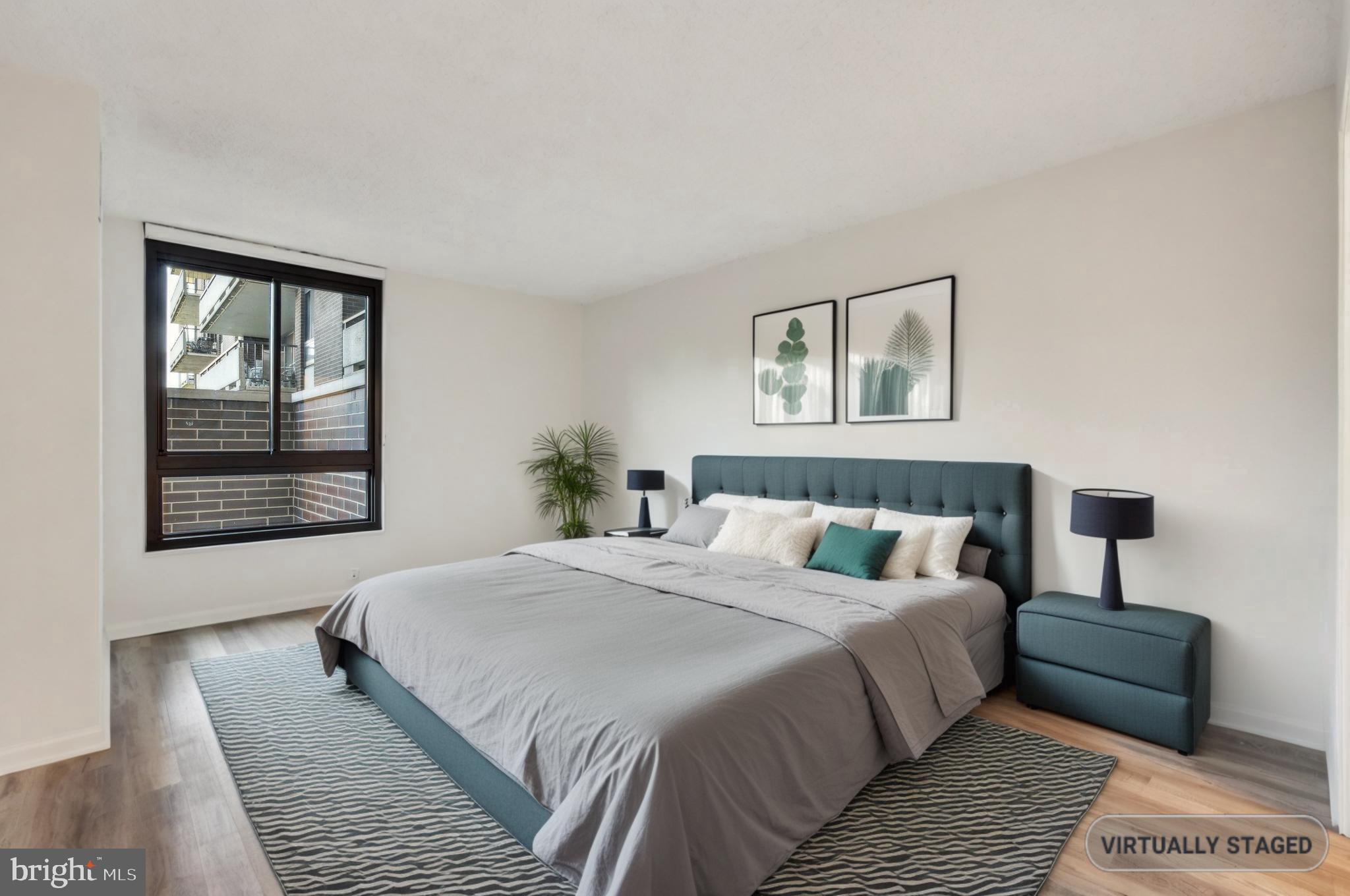 1800 Old Meadow Road, Unit 115 McLean, VA 22102 - Photo 26 of 35 a bedroom with a large bed and a window