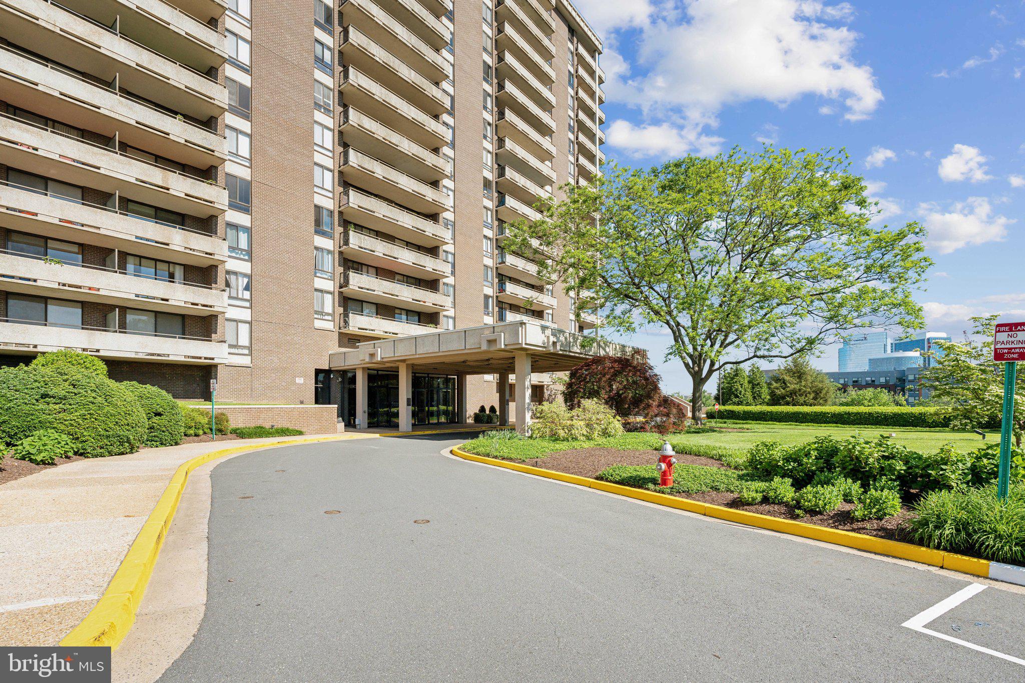 1800 Old Meadow Road, Unit 115 McLean, VA 22102 - Photo 3 of 35 a front view of a building with trees