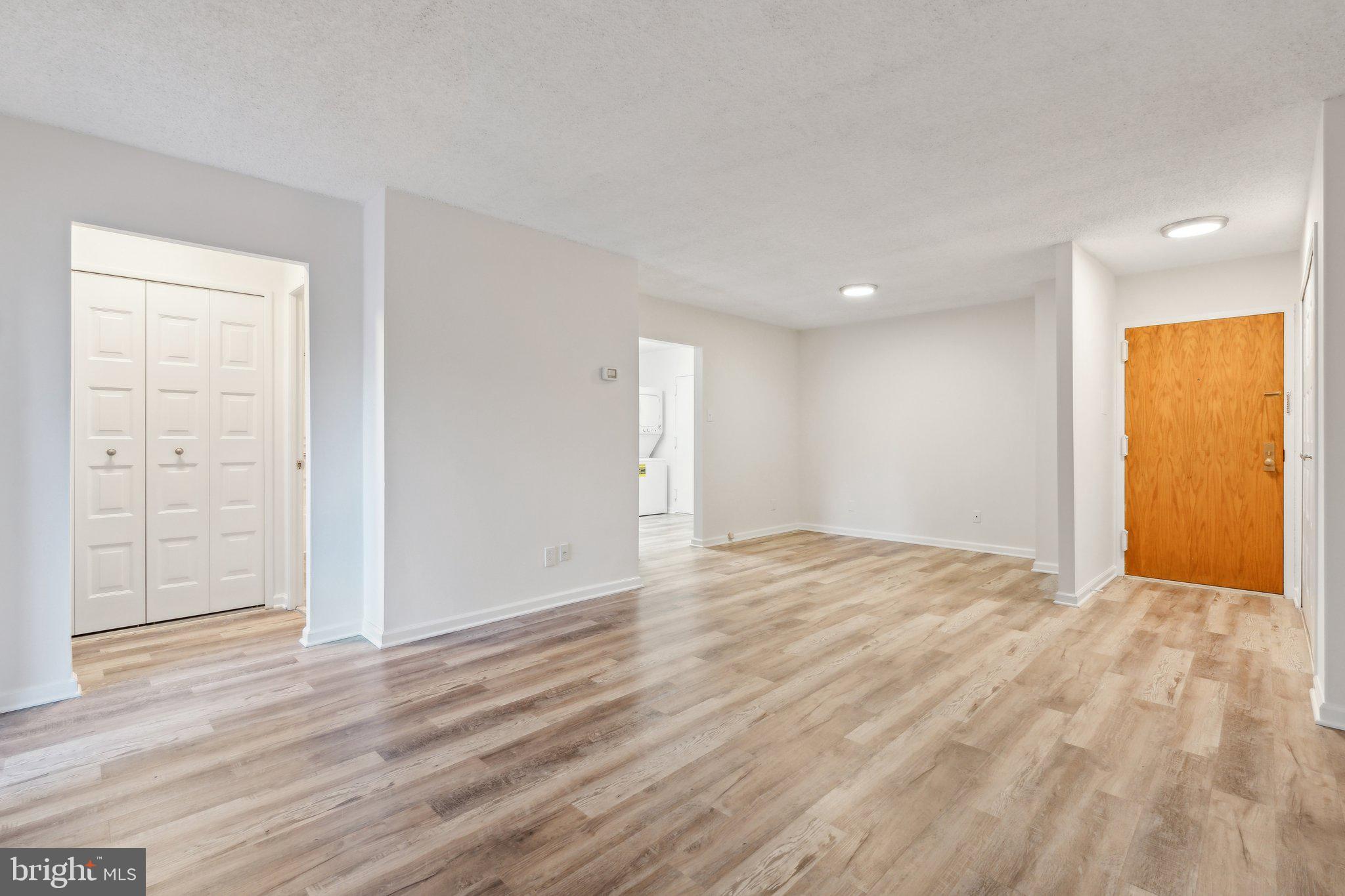1800 Old Meadow Road, Unit 115 McLean, VA 22102 - Photo 8 of 35 a view of an empty room with wooden floor