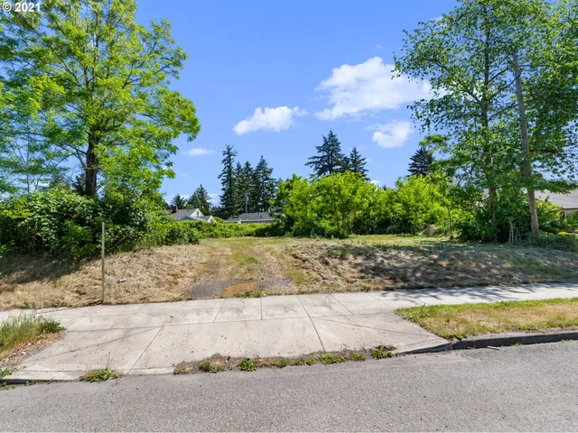 a view of a swimming pool with a yard