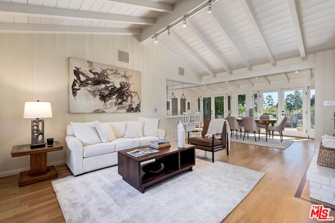 751 Teakwood Road Los Angeles, CA 90049 - Photo 12 of 46 a living room with furniture and wooden floor