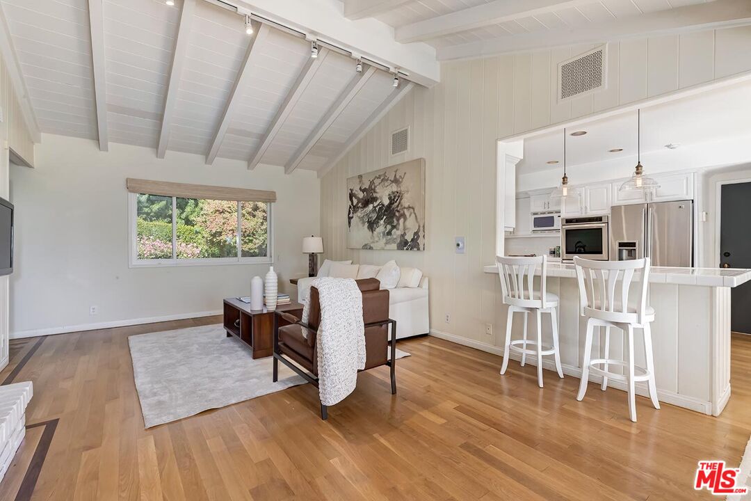 751 Teakwood Road Los Angeles, CA 90049 - Photo 14 of 46 a view of kitchen with furniture and wooden floor