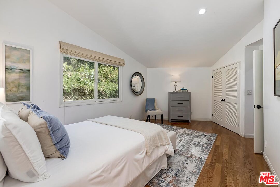 751 Teakwood Road Los Angeles, CA 90049 - Photo 34 of 46 a bedroom with a bed and a window
