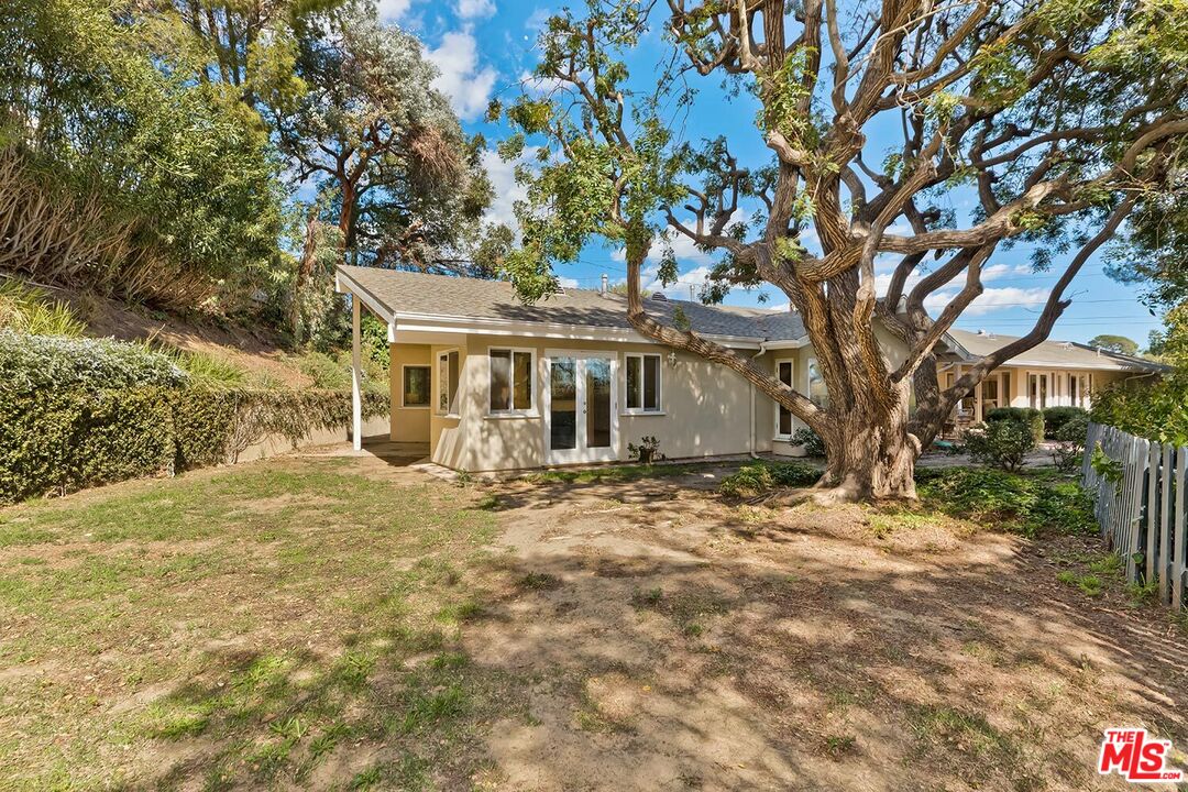 751 Teakwood Road Los Angeles, CA 90049 - Photo 39 of 46 a view of a house with a tree
