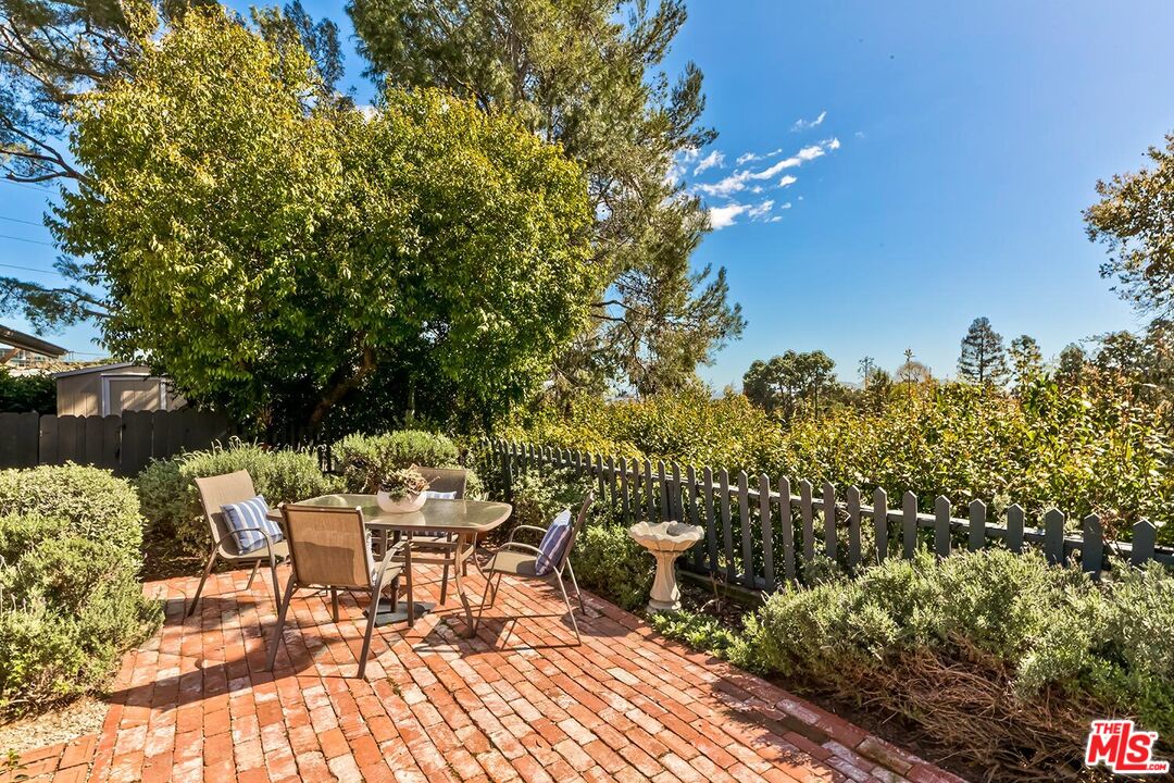 751 Teakwood Road Los Angeles, CA 90049 - Photo 42 of 46 a view of a chairs and table on the terrace
