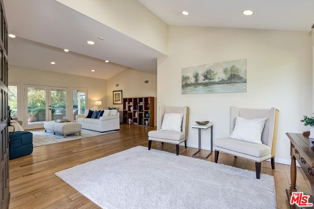 751 Teakwood Road Los Angeles, CA 90049 - Photo 5 of 46 a living room with furniture and a large window