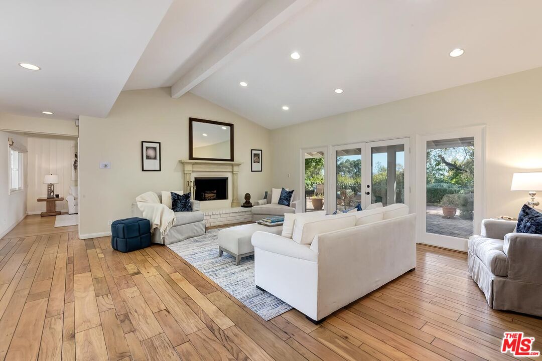 751 Teakwood Road Los Angeles, CA 90049 - Photo 9 of 46 a living room with furniture and a wooden floor