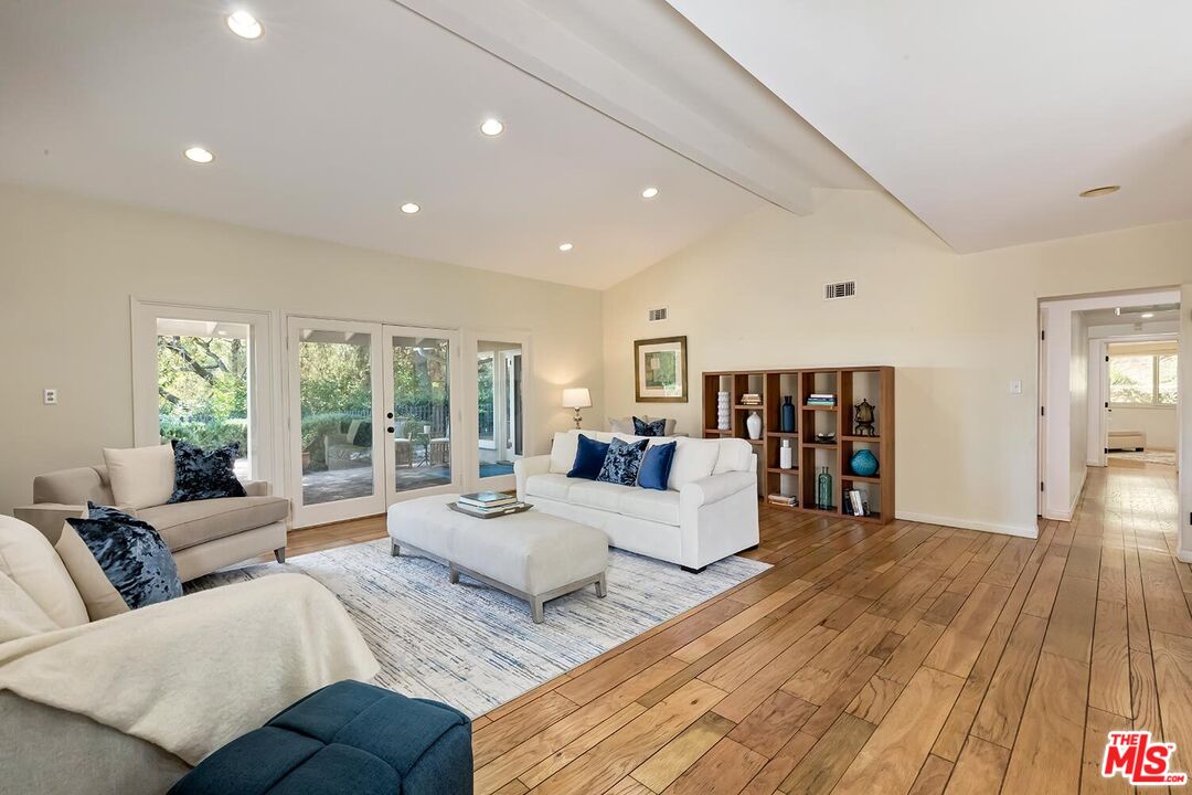 751 Teakwood Road Los Angeles, CA 90049 - Photo 10 of 46 a living room with furniture and a wooden floor