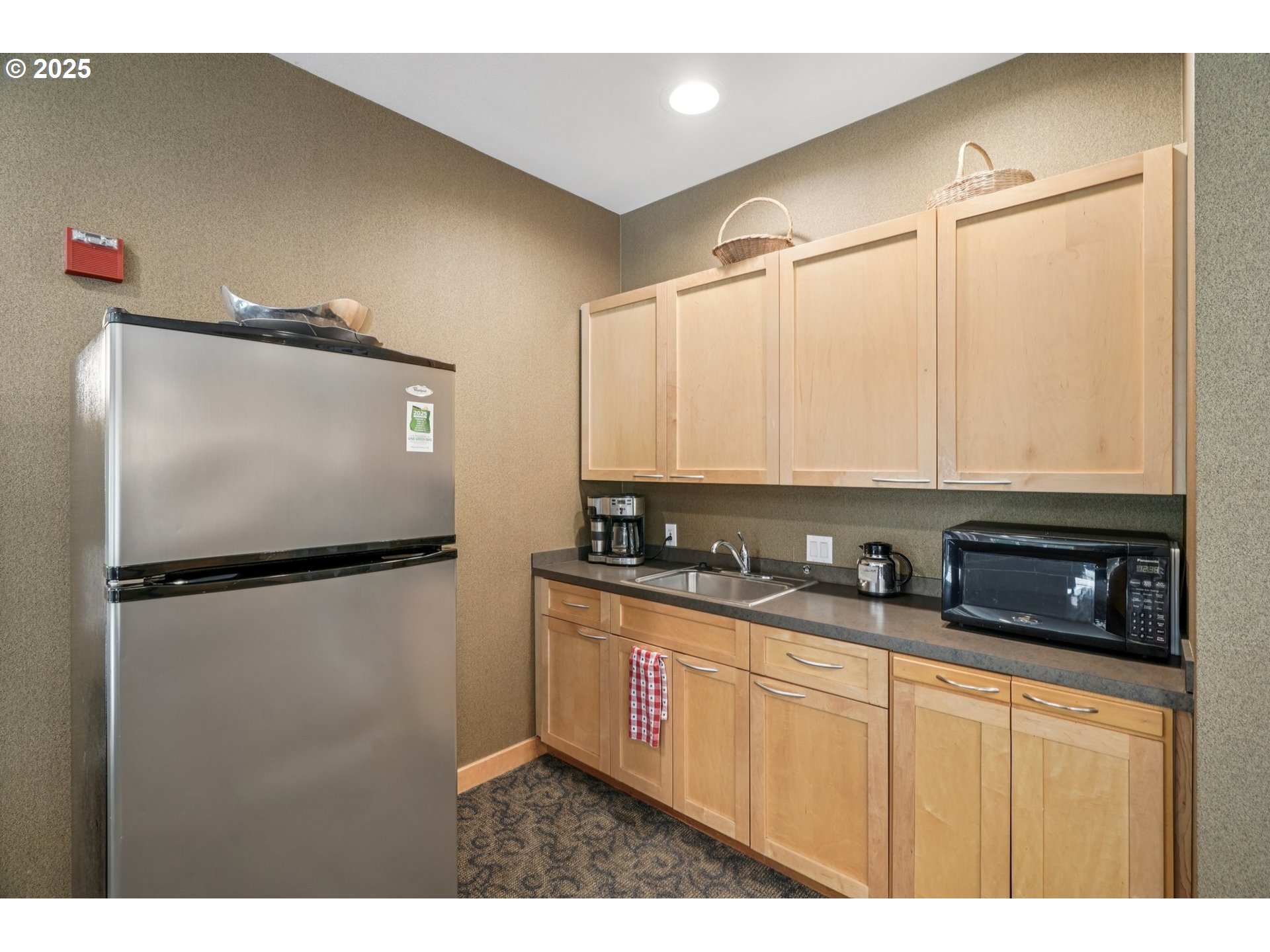 300 West 8th Street, Unit 206 Vancouver, WA 98660 - Photo 36 of 42 a kitchen with stainless steel appliances a refrigerator sink and cabinets