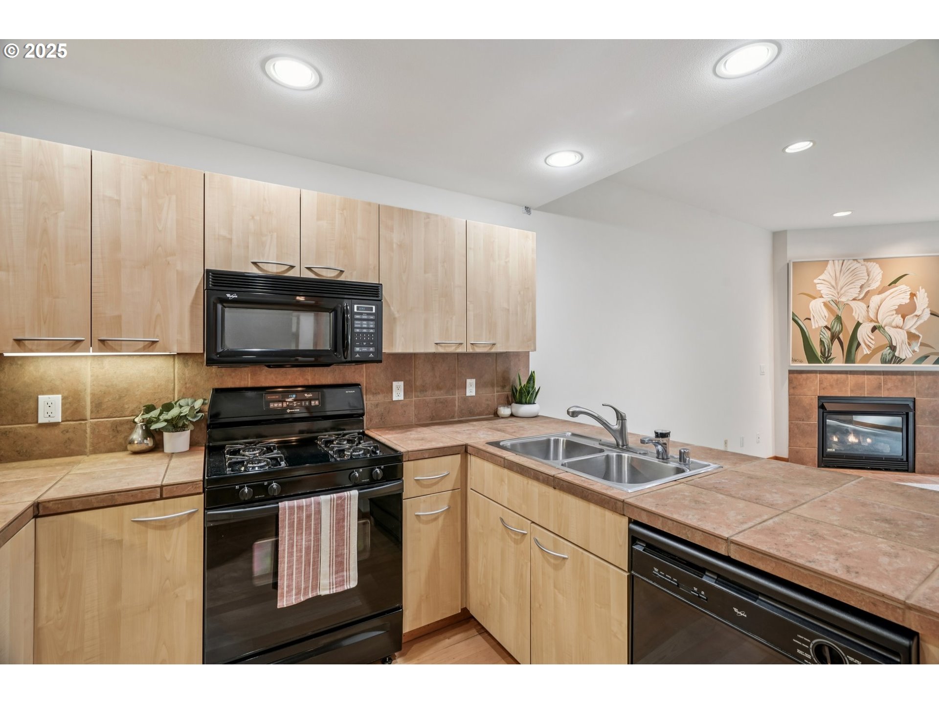 300 West 8th Street, Unit 206 Vancouver, WA 98660 - Photo 7 of 42 a kitchen with granite countertop a sink stainless steel appliances and cabinets