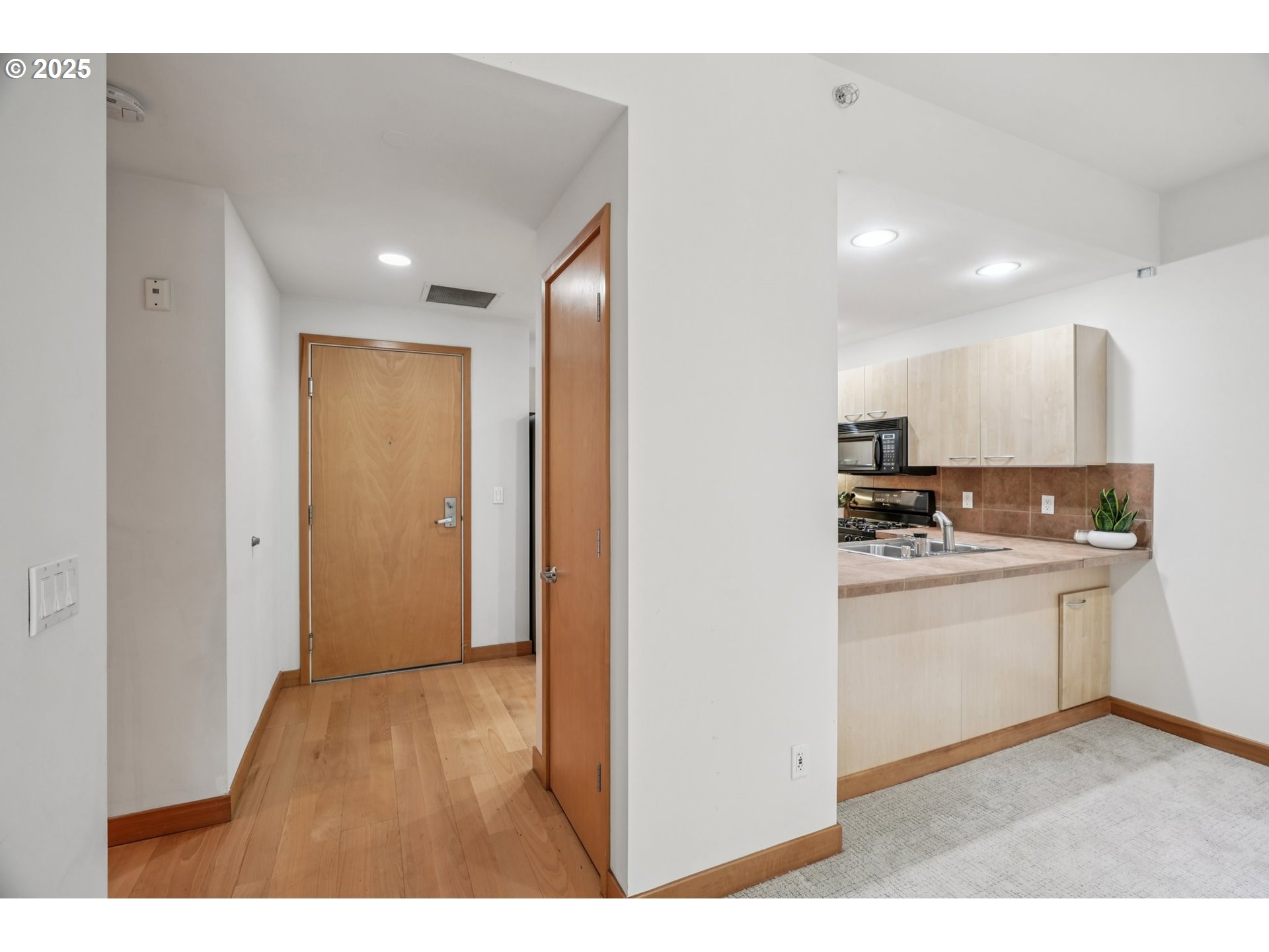 300 West 8th Street, Unit 206 Vancouver, WA 98660 - Photo 8 of 42 a view of kitchen with wooden floor
