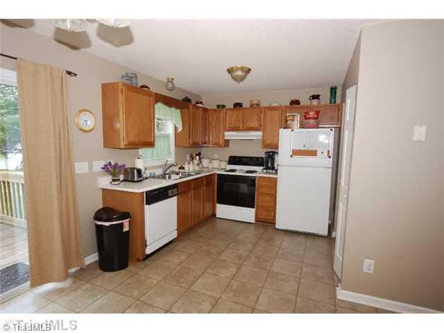 5550 Jason Road Greensboro, NC 27405 - Photo 5 of 16 Exterior Front. Nice Kitchen with Appliances to remain