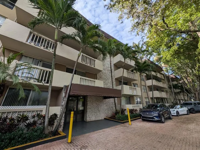 a view of a car park in front of a building