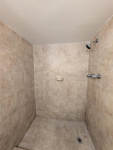 a view of swimming pool with outdoor seating and plants