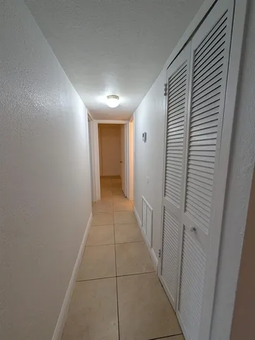 a view of hallway with a window