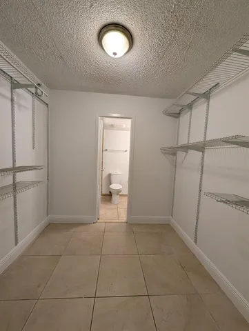 a view of a storage & utility room with a sink
