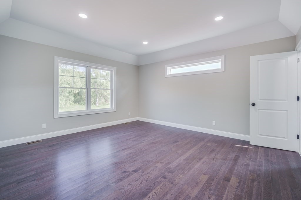 40 Mort Vining Road Southwick, MA 01077 - Photo 13 of 32 an empty room with wooden floor and windows