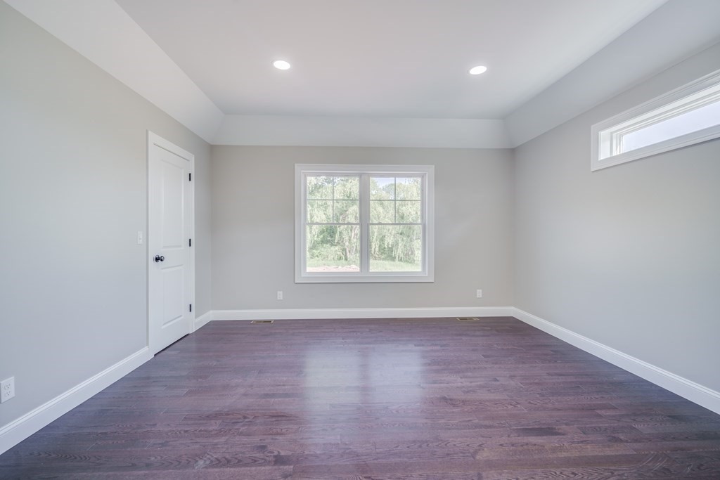 40 Mort Vining Road Southwick, MA 01077 - Photo 15 of 32 wooden floor in an empty room with a window