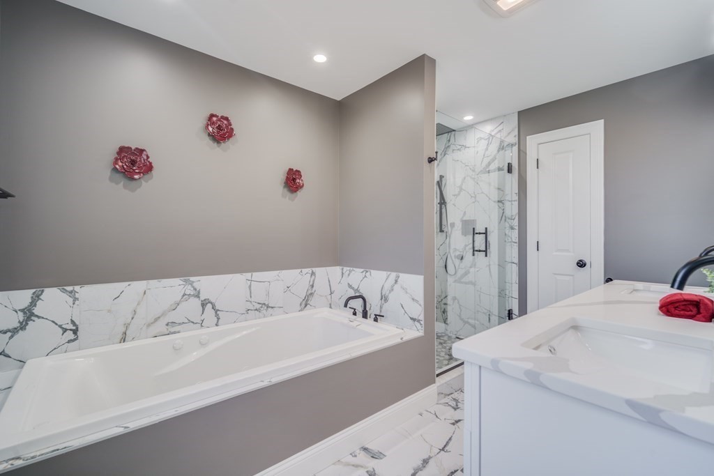 40 Mort Vining Road Southwick, MA 01077 - Photo 16 of 32 a bathroom with a tub sink and a shower