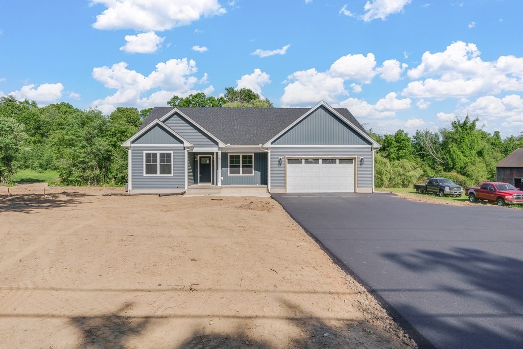 40 Mort Vining Road Southwick, MA 01077 - Photo 2 of 32 a front view of a house with a garden