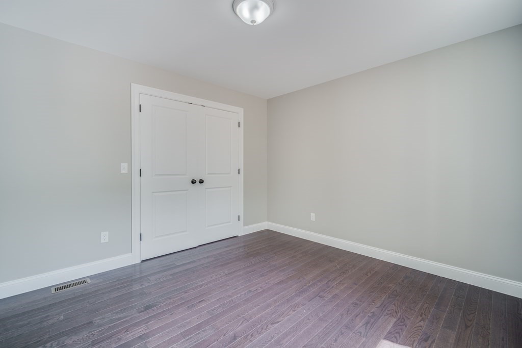 40 Mort Vining Road Southwick, MA 01077 - Photo 24 of 32 a view of an empty room with wooden floor