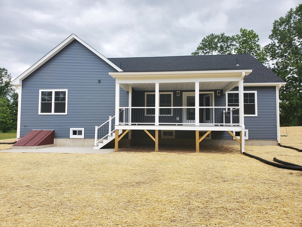 40 Mort Vining Road Southwick, MA 01077 - Photo 29 of 32 a view of a house with a yard and sitting area