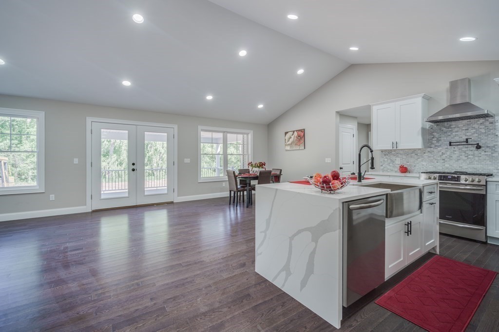 40 Mort Vining Road Southwick, MA 01077 - Photo 7 of 32 a view of a kitchen with stove and wooden floor