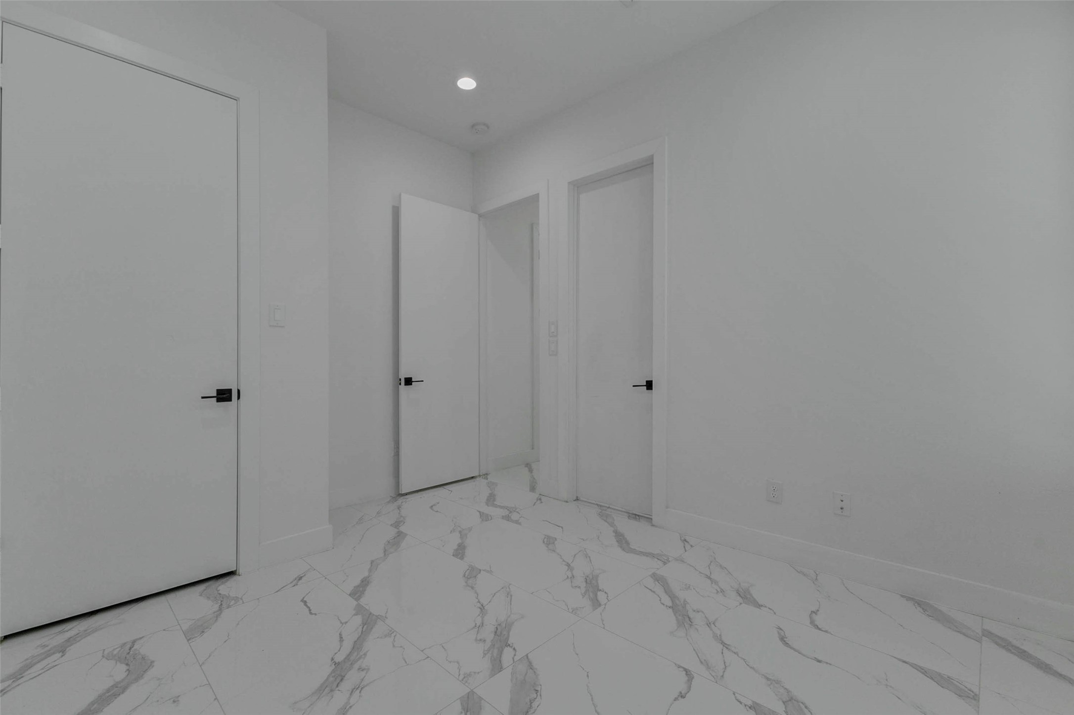 5705 Elysium Street Houston, TX 77091 - Photo 8 of 22 This bedroom offers a comfortable footprint with light flooring, neutral walls, ceiling fan, recessed lighting, and window coverings. The simple modern finish allows for easy furnishing and personalization.