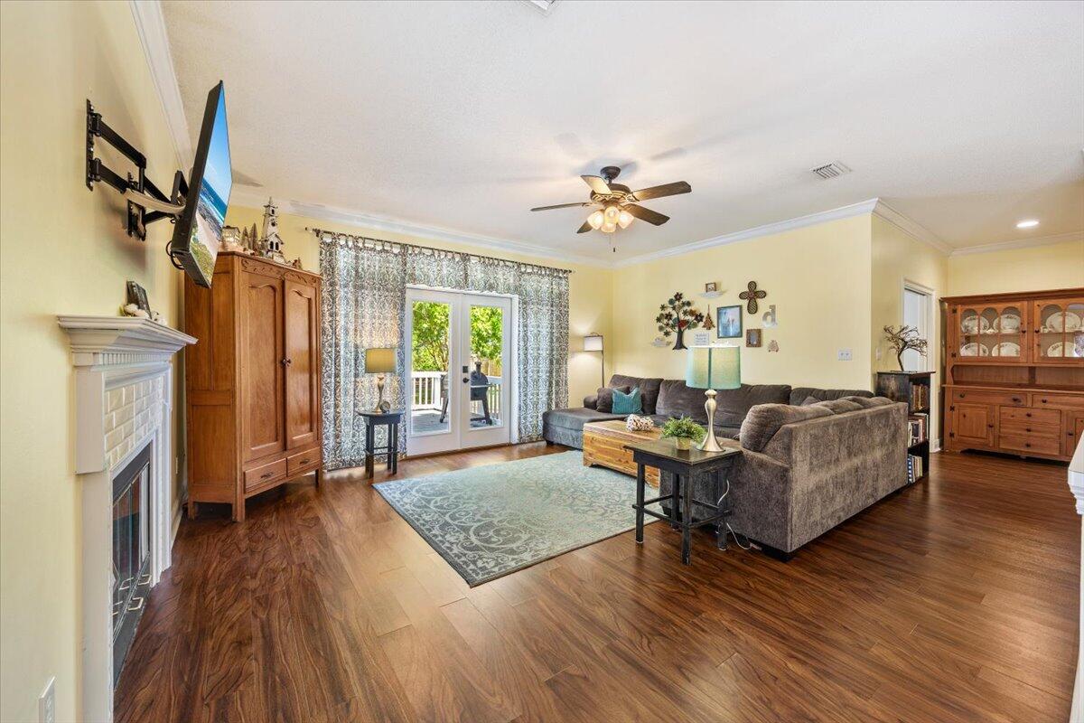 1830 Seahawk Lane Navarre, FL 32566 - Photo 11 of 53 a living room with furniture and a fireplace