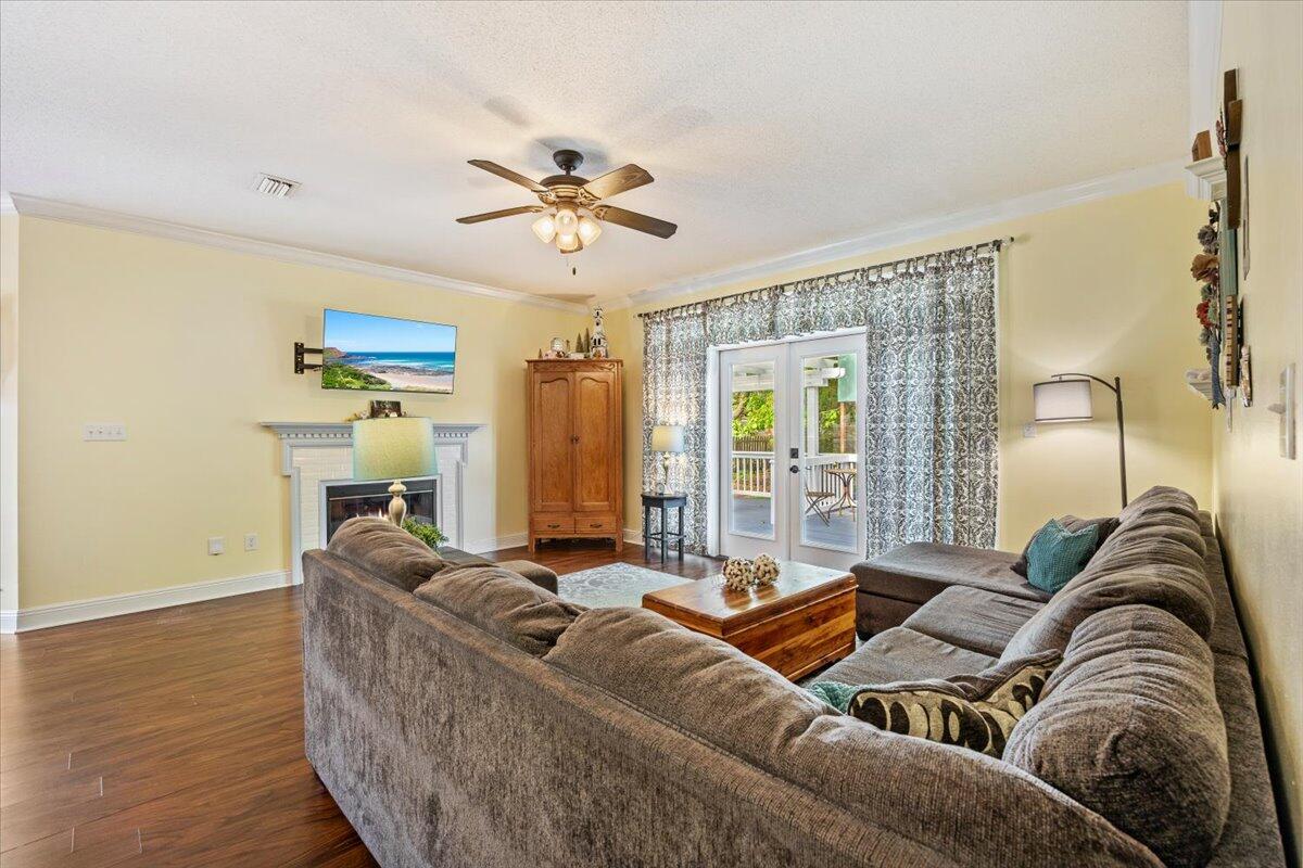1830 Seahawk Lane Navarre, FL 32566 - Photo 12 of 53 a living room with furniture and a large window